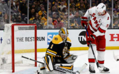 May 6, 2022; Boston, Massachusetts, USA; Boston Bruins goaltender Jeremy Swayman (1) makes a save as Carolina Hurricanes center Jordan Staal (11) looks for the rebound during the first period in game three of the first round of the 2022 Stanley Cup Playoffs at TD Garden. Mandatory Credit: Winslow Townson-USA TODAY Sports