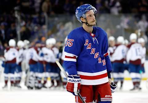 NEW YORK, NEW YORK – OCTOBER 25: Ryan Lindgren #55 of the New York Rangers reacts as the Colorado Avalanche celebrates by winning in a shootout at Madison Square Garden on October 25, 2022, in New York City. The Avalanche won 3-2. (Photo by Sarah Stier/Getty Images)