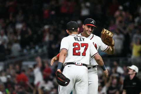 Aug 31, 2022; Cumberland, Georgia, USA; Atlanta Braves third baseman Austin Riley (27) celebrates with first baseman Matt Olson (right) after defeating the Colorado Rockies at Truist Park. Mandatory Credit: Larry Robinson-USA TODAY Sports