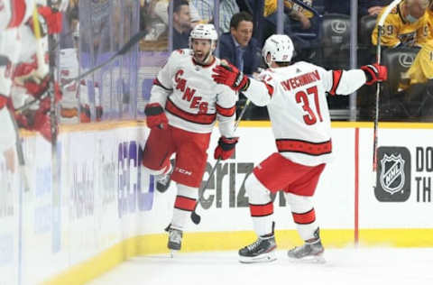 NASHVILLE, TENNESSEE – MAY 21: Vincent Trocheck #16 of the Carolina Hurricanes celebrates with Andrei Svechnikov #37 after scoring a goal in the second period against the Nashville Predators in Game Three of the First Round of the 2021 Stanley Cup Playoffs at Bridgestone Arena on May 21, 2021, in Nashville, Tennessee. (Photo by Andy Lyons/Getty Images)