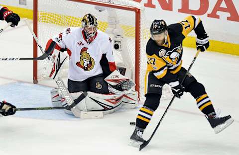 May 25, 2017; Pittsburgh, PA, USA;Pittsburgh Penguins right wing Bryan Rust (17) tries to re-direct the puck past Ottawa Senators goalie Craig Anderson (41) during the second period in game seven of the Eastern Conference Final of the 2017 Stanley Cup Playoffs at PPG PAINTS Arena. Mandatory Credit: Don Wright-USA TODAY Sports