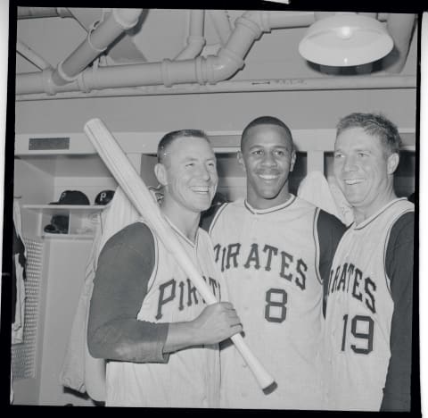 Bill Mazeroski (left), Willie Stargell, (center), and Bob Friend (right), flash winning smiles in clubhouse after beating N.Y. Mets, 4-3 in their debut at the new $25,000,000 Shea Stadium after April 17th victory. Mazeroski singled knocking in run that beat the Mets.