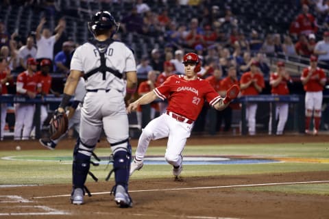 Tyler O’Neill of Team Canada safely slides in to home against Team Great Britain during the first inning of the World Baseball Classic Pool C game at Chase Field in Phoenix. (Photo by Chris Coduto/Getty Images)