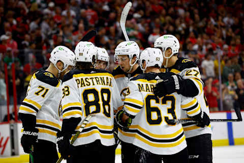 RALEIGH, NORTH CAROLINA – MAY 14: The Boston Bruins celebrate following a third period goal in Game Seven of the First Round of the 2022 Stanley Cup Playoffs against the Carolina Hurricanes at PNC Arena on May 14, 2022 in Raleigh, North Carolina. (Photo by Jared C. Tilton/Getty Images)