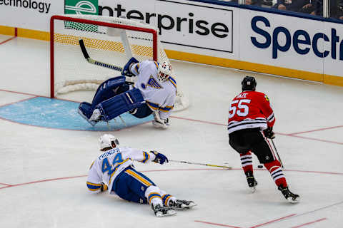 ST. LOUIS, MO – DECEMBER 31: Chicago Blackhawks Forward Eric Daze (55) moves in for a shot in front of a sliding St. Louis Blues Defenseman Chris Pronger (44) during the first period of the NHL Winter Classic Alumni hockey game between the Chicago Blackhawks and the St. Louis Blues on December 31, 2016, at Scottrade Center in St. Louis, MO. (Photo by Tim Spyers/Icon Sportswire via Getty Images)