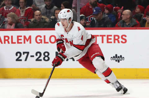 Feb 29, 2020; Montreal, Quebec, CAN; Carolina Hurricanes defenseman Haydn Fleury (4) plays the puck against Montreal Canadiens during the second period at Bell Centre. Mandatory Credit: Jean-Yves Ahern-USA TODAY Sports