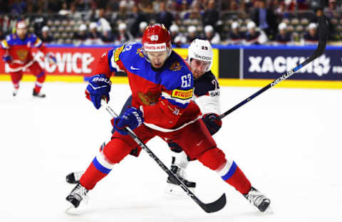 COLOGNE, GERMANY – MAY 16: Yevgeni Dadonov of Russia is challenged by Brock Nelson of the USA during the Russia v USA 2017 IIHF Ice Hockey World Championship match at Lanxess Arena on May 16, 2017 in Cologne, Germany. (Photo by Martin Rose/Getty Images)