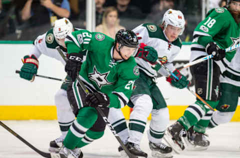 NHL Power Rankings: Dallas Stars center Cody Eakin (20) and Minnesota Wild center Mikael Granlund (64) chase the puck during the third period at the American Airlines Center. The Wild defeat the Stars 3-2 in the overtime shootout. Mandatory Credit: Jerome Miron-USA TODAY Sports