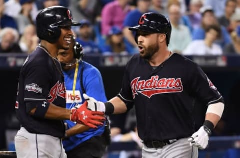 Oct 17, 2016; Toronto, Ontario, CAN; Cleveland Indians second baseman Jason Kipnis (right) is congratulated by shortstop Francisco Lindor (12) for hitting a solo home run against the Toronto Blue Jays during the sixth inning in game three of the 2016 ALCS playoff baseball series at Rogers Centre. Mandatory Credit: Nick Turchiaro-USA TODAY Sports