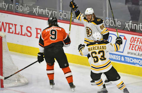 Feb 3, 2021; Philadelphia, Pennsylvania, USA; Boston Bruins right wing David Pastrnak (88) celebrates his goal with center Brad Marchand (63) against Philadelphia Flyers defenseman Ivan Provorov (9) during the first period at Wells Fargo Center. Mandatory Credit: Eric Hartline-USA TODAY Sports