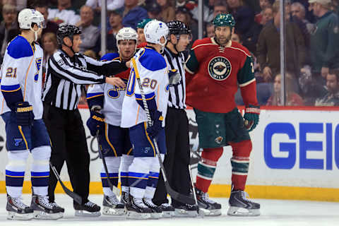 Apr 10, 2014; Saint Paul, MN, USA; St. Louis Blues left wing Alexander Steen (20) confronts Minnesota Wild left wing Mike Rupp (27) after a hit on right wing T.J. Oshie (74) in the second period at Xcel Energy Center. Mandatory Credit: Brad Rempel-USA TODAY Sports