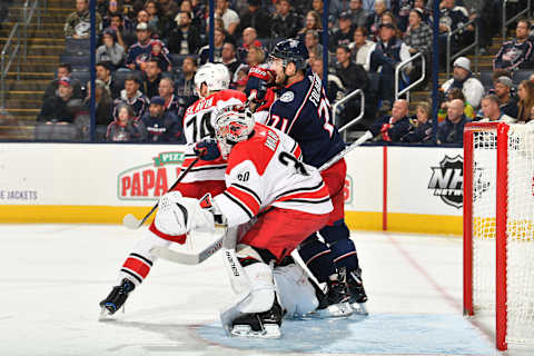 COLUMBUS, OH – NOVEMBER 10: Goaltender Cam Ward #30 of the Carolina Hurricanes, Jaccob Slavin #74 of the Carolina Hurricanes and Nick Foligno #71 of the Columbus Blue Jackets battle for position in front of the net during the third period of a game on November 10, 2017 at Nationwide Arena in Columbus, Ohio. (Photo by Jamie Sabau/NHLI via Getty Images)