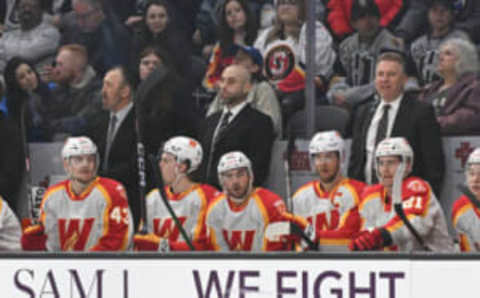 HENDERSON, NEVADA – FEBRUARY 26: Mitch Love, head coach of the Calgary Wranglers on the bench in the game against the Henderson Silver Knights at The Dollar Loan Center on February 26, 2023 in Henderson, Nevada. The Silver Knights defeated the Wranglers 2-1. (Photo by Candice Ward/Getty Images)