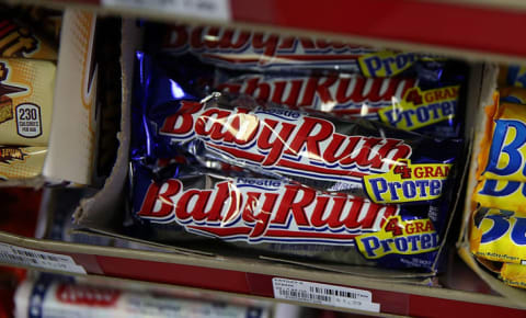 A stack of Baby Ruth bars in a box.