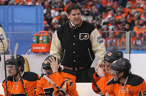 PHILADELPHIA, PA – JANUARY 02: Head Coach Peter Laviolette of the Philadelphia Flyers watches play against the New York Rangers during the 2012 Bridgestone NHL Winter Classic at Citizens Bank Park on January 2, 2012, in Philadelphia, Pennsylvania. The Rangers won 3-2 in regulation. (Photo by Bruce Bennett/Getty Images)