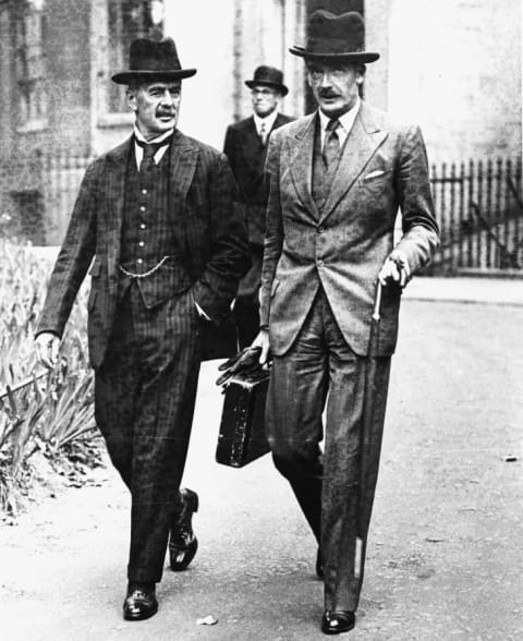 British Foreign Secretary Sir Anthony Eden (right) with Neville Chamberlain, Leader of the Conservative Party, wearing Homburg hats while walking in London in 1937.