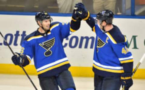 Oct 8, 2015; St. Louis, MO, USA; St. Louis Blues right wing Troy Brouwer (L) celebrates with center David Backes (R) after scoring an empty net goal against the Edmonton Oilers during the third period at Scottrade Center. Mandatory Credit: Jasen Vinlove-USA TODAY Sports