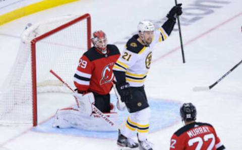 May 4, 2021; Newark, New Jersey, USA; Boston Bruins left wing Nick Ritchie (21) celebrates after a goal in front of New Jersey Devils goaltender Mackenzie Blackwood (29) and defenseman Ryan Murray (22) during the second period at Prudential Center. Mandatory Credit: Vincent Carchietta-USA TODAY Sports