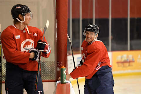 ARLINGTON, VA – MARCH 02: Jakub Vrana #13 of the Washington Capitals smiles near the bench area as Nicklas Backstrom #19 looks on during the Washington Capitals practice session at Kettler Capitals Iceplex on March 2, 2018 in Arlington, Virginia. (Photo by Brian Babineau/NHLI via Getty Images)