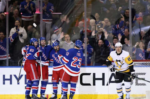 NEW YORK, NEW YORK – MARCH 16: Chris Kreider #20 of the New York Rangers (2nd from left) celebrates his empty net goal against the Pittsburgh Penguins at Madison Square Garden on March 16, 2023, in New York City. The Rangers defeated the Penguins 5-3. (Photo by Bruce Bennett/Getty Images)