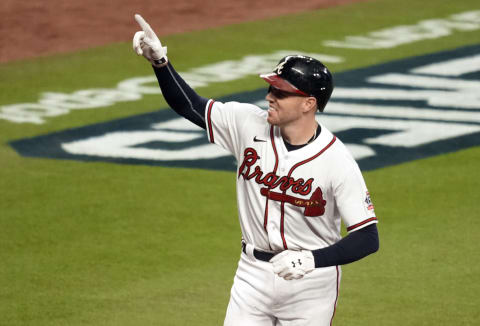 Oct 31, 2021; Atlanta, Georgia, USA; Atlanta Braves first baseman Freddie Freeman (5) hits a home run against the Houston Astros during the third inning of game five of the 2021 World Series at Truist Park. Mandatory Credit: Dale Zanine-USA TODAY Sports