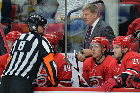 RALEIGH, NC – FEBRUARY 23: NHL referee Dave Jackson (8) explains a call to Carolina Hurricanes head coach Bill Peters during a game between the Pittsburgh Penguins and the Carolina Hurricanes at the PNC Arena in Raleigh, NC on February 23, 2018. Pittsburgh defeated Carolina 6-1. (Photo by Greg Thompson/Icon Sportswire via Getty Images)