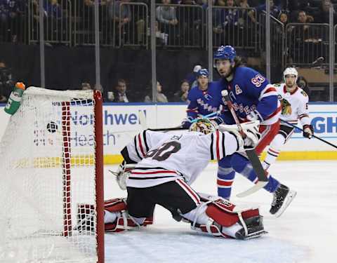 NEW YORK, NEW YORK – JANUARY 17: Mika Zibanejad #93 of the New York Rangers scores against Collin Delia #60 of the Chicago Blackhawks but the goal is disallowed because the play was offside during the second period at Madison Square Garden on January 17, 2019 in New York City. The Rangers defeated the Blackhawks 4-3. (Photo by Bruce Bennett/Getty Images)