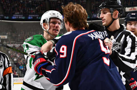 COLUMBUS, OH – JANUARY 18: Linesmen Bevan Mills #53 breaks up a scuffle between Antoine Roussel #21 of the Dallas Stars and Artemi Panarin #9 of the Columbus Blue Jackets during the second period of a game on January 18, 2018 at Nationwide Arena in Columbus, Ohio. (Photo by Jamie Sabau/NHLI via Getty Images)