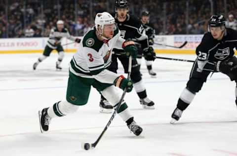 LOS ANGELES, CA – APRIL 05: Charlie Coyle #3 of the Minnesota Wild shoots the puck as Dustin Brown #23 of the Los Angeles Kings defends during the third period of a game at Staples Center on April 5, 2018 in Los Angeles, California. (Photo by Sean M. Haffey/Getty Images)