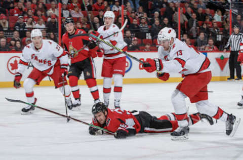 OTTAWA, ON – NOVEMBER 9: Colin White #36 of the Ottawa Senators is tripped on a scoring chance by Warren Foegele #13 of the Carolina Hurricanes leading to a penalty at Canadian Tire Centre on November 9, 2019 in Ottawa, Ontario, Canada. (Photo by Andre Ringuette/NHLI via Getty Images)