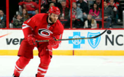 RALEIGH, NC – FEBRUARY 12: Tim Gleason #6 of the Carolina Hurricanes bats down an errant puck during an NHL game against the Anaheim Ducks during at PNC Arena on February 12, 2015 in Raleigh, North Carolina. (Photo by Gregg Forwerck/NHLI via Getty Images)