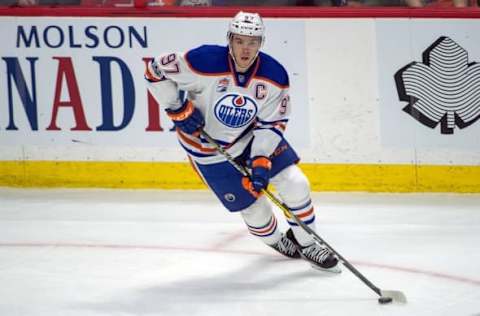 NHL Mid-Season Awards: Edmonton Oilers center Connor McDavid (97) skates with the puck in the third period against the Ottawa Senators at the Canadian Tire Centre. The Senators defeated the Oilers 5-3. Mandatory Credit: Marc DesRosiers-USA TODAY Sports