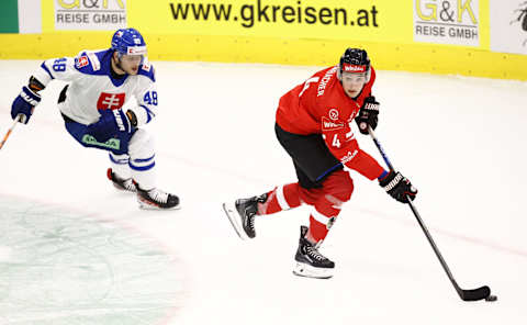 Slovakia’s Viliam Cacho (L) and Austria’s David Reinbacher vie for the puck during the ice hockey match between Austria and Slovakia on May 4, 2023 in Kapfenberg, Austria (Photo by ERWIN SCHERIAU / APA / AFP) / Austria OUT (Photo by ERWIN SCHERIAU/APA/AFP via Getty Images)