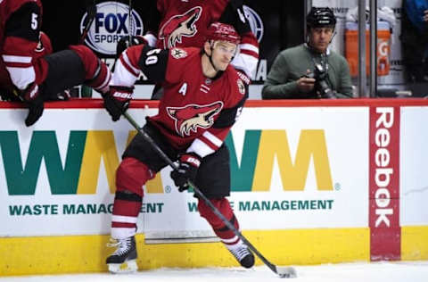 Mar 17, 2016; Glendale, AZ, USA; Arizona Coyotes center Antoine Vermette (50) looks to pass during the second period against the San Jose Sharks at Gila River Arena. Mandatory Credit: Matt Kartozian-USA TODAY Sports