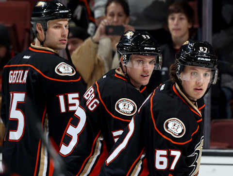 ANAHEIM, CA – JANUARY 15: Rickard Rakell #67, Jakob Silfverberg #33 and Ryan Getzlaf #15 of the Anaheim Ducks look on during warmups before the game against the Dallas Stars on January 15, 2016, at Honda Center in Anaheim, California. (Photo by Debora Robinson/NHLI via Getty Images)