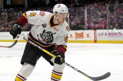 CLEVELAND, OH – JANUARY 26: Chicago Wolves defenceman Griffin Reinhart (6) follows the puck into the corner during the first period of the American Hockey League game between the Chicago Wolves and Cleveland Monsters on January 26, 2019, at Quicken Loans Arena in Cleveland, OH. (Photo by Frank Jansky/Icon Sportswire via Getty Images)