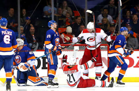 NEW YORK, NEW YORK – APRIL 28: Nino Niederreiter #21 of the Carolina Hurricanes is congratulated by his teammate Jordan Staal #11 after scoring a third period goal as Robin Lehner #40, Brock Nelson #29 and Adam Pelech #3 of the New York Islanders react in Game Two of the Eastern Conference Second Round during the 2019 NHL Stanley Cup Playoffs at Barclays Center on April 28, 2019 in New York City. (Photo by Mike Stobe/NHLI via Getty Images)