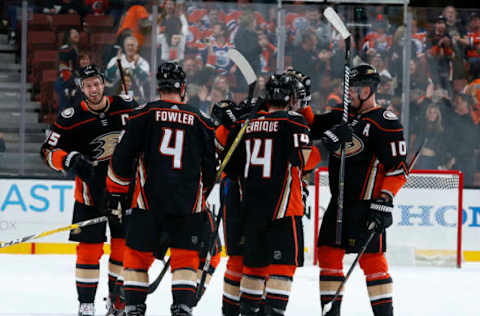 ANAHEIM, CA: Ryan Getzlaf #15, Cam Fowler #4, Adam Henrique #14, and Corey Perry #10 of the Anaheim Ducks celebrate a third-period goal during the game against the Edmonton Oilers on February 25, 2018. (Photo by Debora Robinson/NHLI via Getty Images)