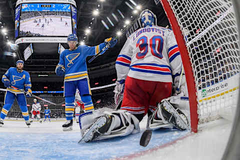 aden Schwartz #17 of the St. Louis Blues celebrates after the puck goes by Henrik Lundqvist #30 of the New York Rangers