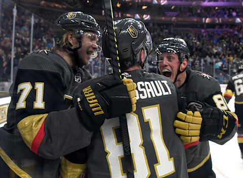 LAS VEGAS, NEVADA – FEBRUARY 13: William Karlsson #71, Jonathan Marchessault #81 and Nate Schmidt #88 of the Vegas Golden Knights celebrate after Marchessault scored a power-play goal in overtime to defeat the St. Louis Blues 6-5 during their game at T-Mobile Arena on February 13, 2020 in Las Vegas, Nevada. (Photo by Ethan Miller/Getty Images)