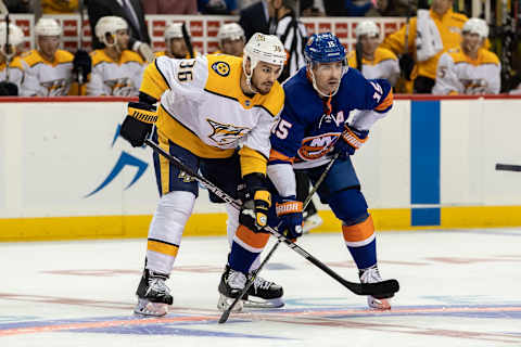 BROOKYN, NY – OCTOBER 06: Zan Rinaldo (36) of the Nashville Predators lines up against New York Islanders forward Cal Clutterbuck (15) during the New York Islanders game versus the Nashville Predators on October 6, 2018, at the Barclays Center in Brooklyn, NY. (Photo by John McCreary/Icon Sportswire via Getty Images)