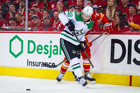 May 15, 2022; Calgary, Alberta, CAN; Dallas Stars center Vladislav Namestnikov (92) battle for the puck during the third period against the Calgary Flames in game seven of the first round of the 2022 Stanley Cup Playoffs at Scotiabank Saddledome. Mandatory Credit: Sergei Belski-USA TODAY Sports