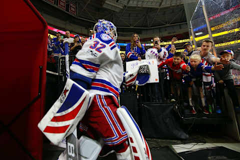 Mar 9, 2017; Raleigh, NC, USA; New York Rangers goalie Antti Raanta (32) goes past Ranger fans before the game against the Carolina Hurricanes at PNC Arena. The Hurricanes defeated the Rangers 4-3. Mandatory Credit: James Guillory-USA TODAY Sports