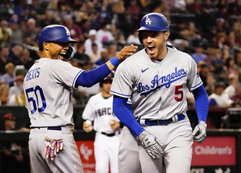 May 26, 2022; Phoenix, Arizona, USA; Los Angeles Dodgers Mookie Betts (50) reacts after Freddie Freeman (5) hit a three-run, home run against the Arizona Diamondbacks in the second inning at Chase Field.Mlb Los Angeles Dodgers At Arizona Diamondbacks