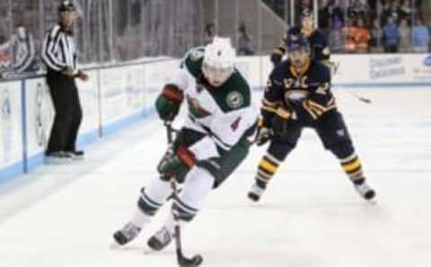 Sep 26, 2016; State College, PA, USA; Minnesota Wild defensemen Mike Reilly (4) handles the puck during the second period against the Buffalo Sabres during a preseason hockey game at Pegula Ice Arena. Mandatory Credit: Matthew O