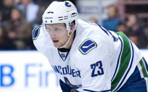 EDMONTON, AB – OCTOBER 19: Alexander Edler #23 of the Vancouver Canucks concentrates on the face-off during a game against the Edmonton Oilers at Rexall Place on October 19, 2009 in Edmonton, Alberta, Canada. The Oilers beat the Canucks 2-1. (Photo by Andy Devlin/NHLI via Getty Images)