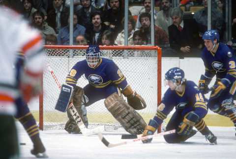 NEW YORK – CIRCA 1983: Goalie Bob Sauve #28 of the Buffalo Sabers defends his goal against the New York Rangers during an NHL Hockey game circa 1983 at Madison Square Garden in the Manhattan borough of New York City. Sauve playing career went from 1976-89. (Photo by Focus on Sport/Getty Images)