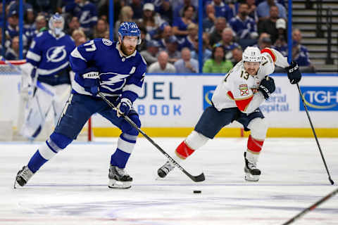 TAMPA, FL – MAY 23: Victor Hedman #77 of the Tampa Bay Lightning brings the puck up the ice against Sam Reinhart #13 of the Florida Panthers during the second period in Game Four of the Second Round of the 2022 Stanley Cup Playoffs at Amalie Arena on May 23, 2022 in Tampa, Florida. (Photo by Mike Carlson/Getty Images)