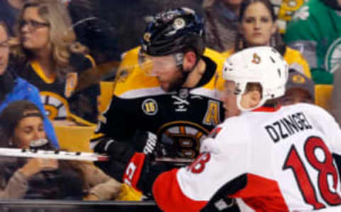 Apr 6, 2017; Boston, MA, USA; Ottawa Senators left wing Ryan Dzingel (18) and Boston Bruins right wing David Backes (42) battle for a loose puck during the second period at TD Garden. Mandatory Credit: Winslow Townson-USA TODAY Sports