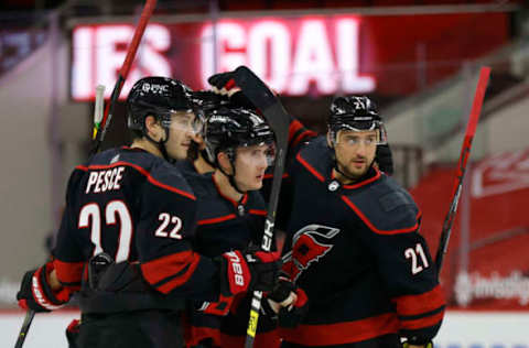 RALEIGH, NORTH CAROLINA – MARCH 04: Martin Necas #88 of the Carolina Hurricanes celebrates with his teammates following a goal scored during the second period of their game against the Detroit Red Wings at PNC Arena on March 04, 2021, in Raleigh, North Carolina. (Photo by Jared C. Tilton/Getty Images)